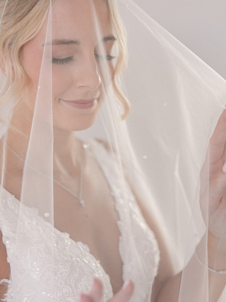 bride under the veil during bridal session at Davis & Grey Farms