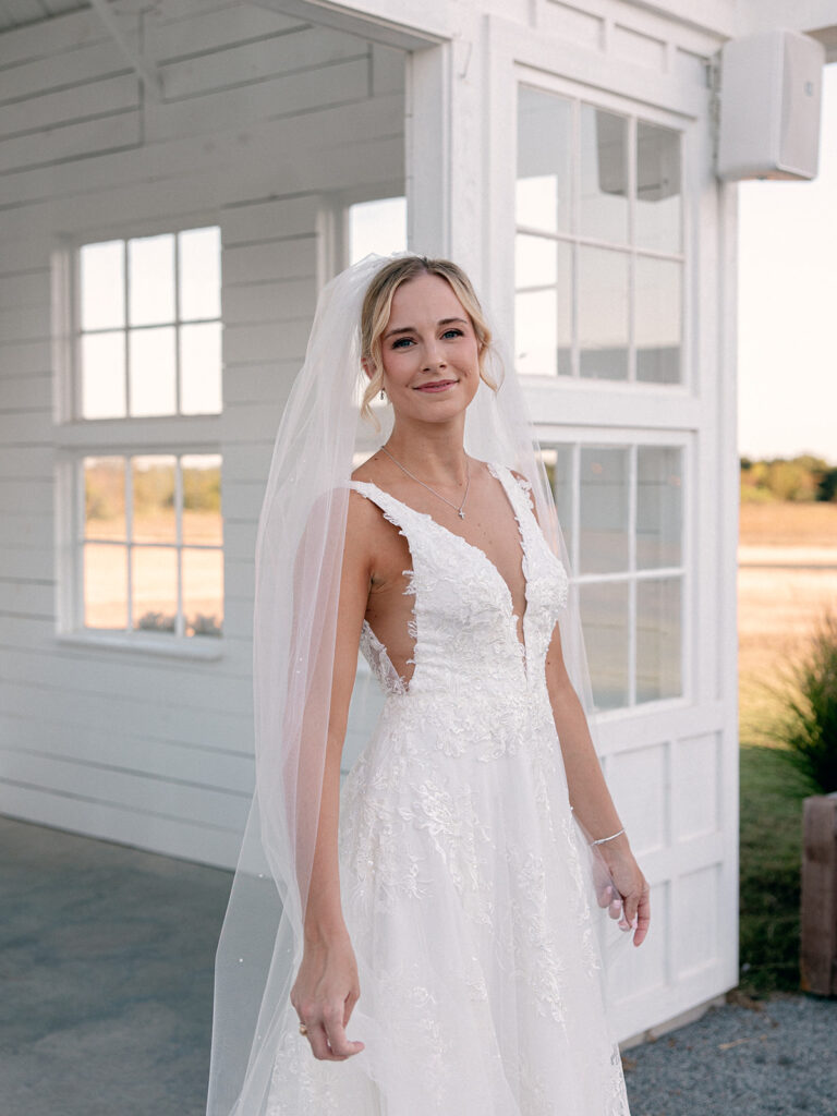 bride by outdoor chapel during bridal session at davis and grey farms