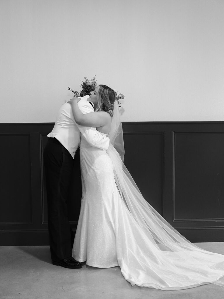 bride and groom hug immediately after ceremony as they are now husband and wife