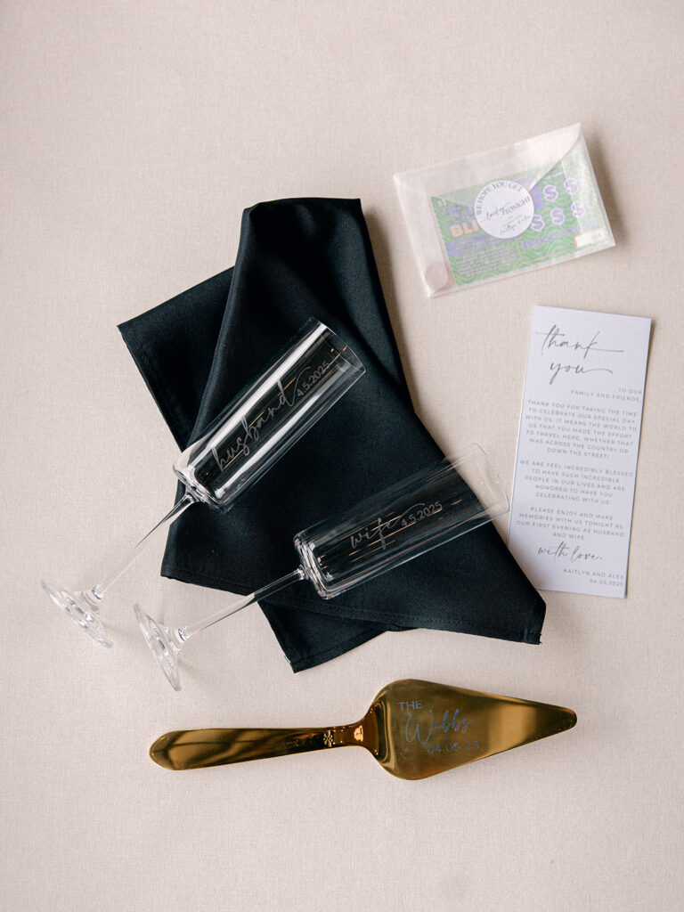 champagne flutes and a thank you note to the wedding guests for the couples wedding at Davis & Grey Farms