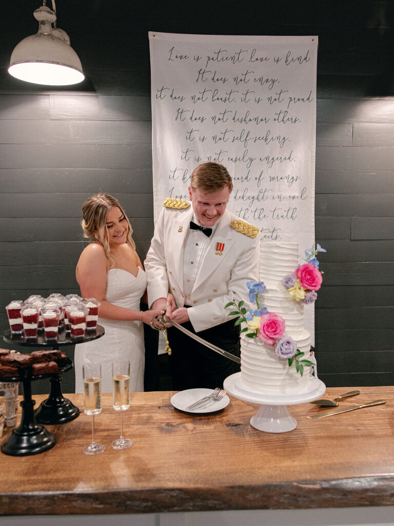 bride and groom cutting their cake during their wedding at davis & grey farms
