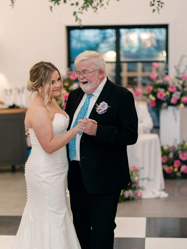 bride and father of the bride dancing at the wedding reception at davis & grey farms