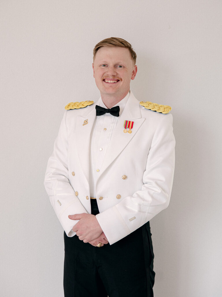 solo groom portrait smiling at the camera