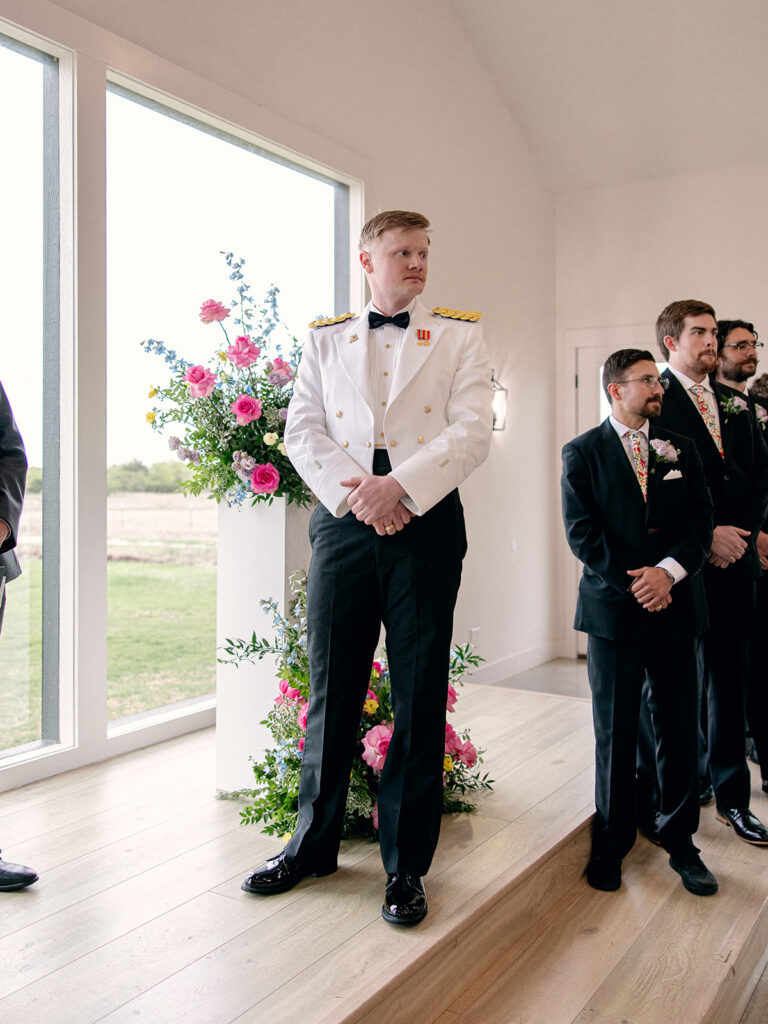 groom waiting at the altar for the bride to walk down the aisle for their wedding at Dav& Grey Farms