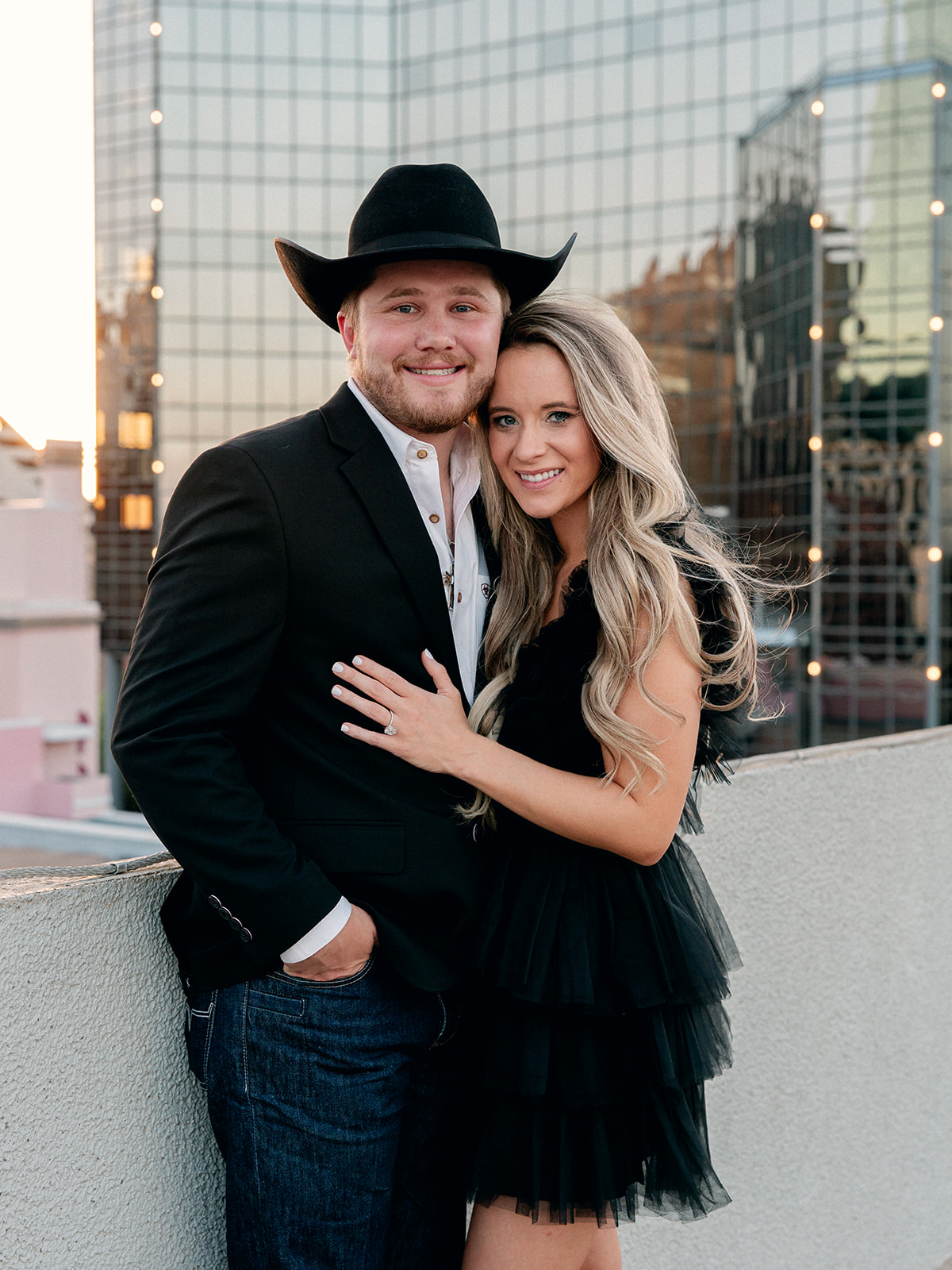 downtown fort worth engagement session of man and woman smiling at camera