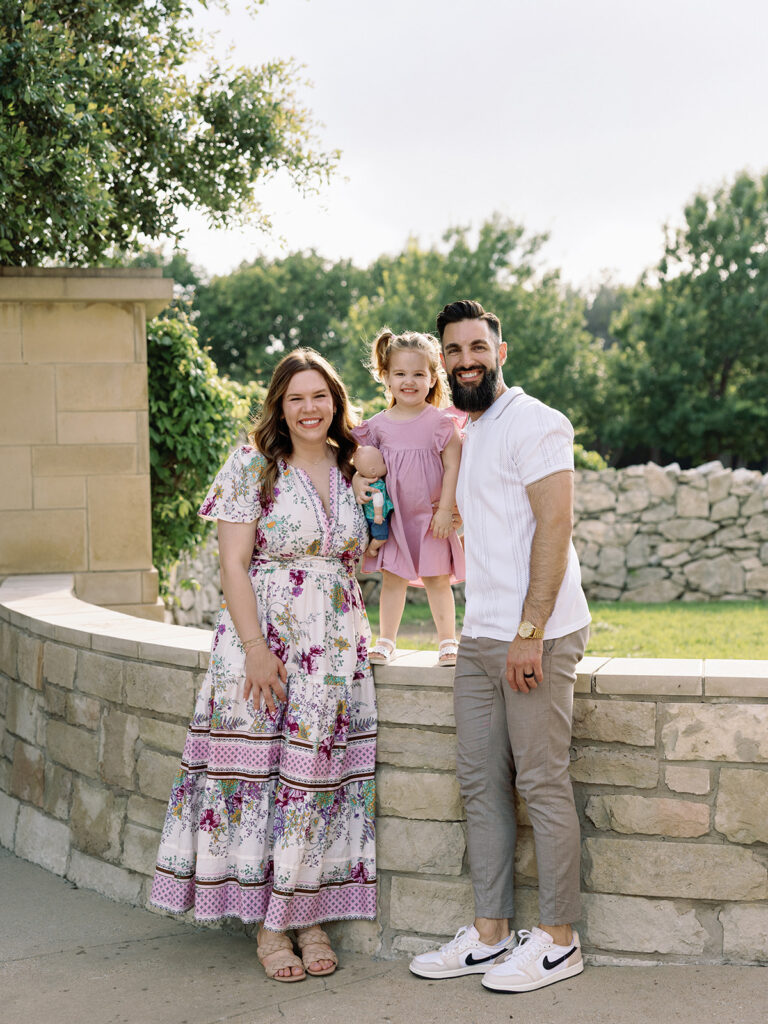 mom dad and young daughter family photo session in north dallas