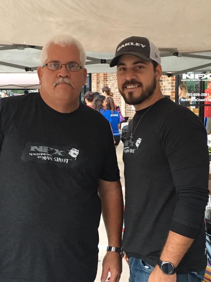 father and son smiling for camera
