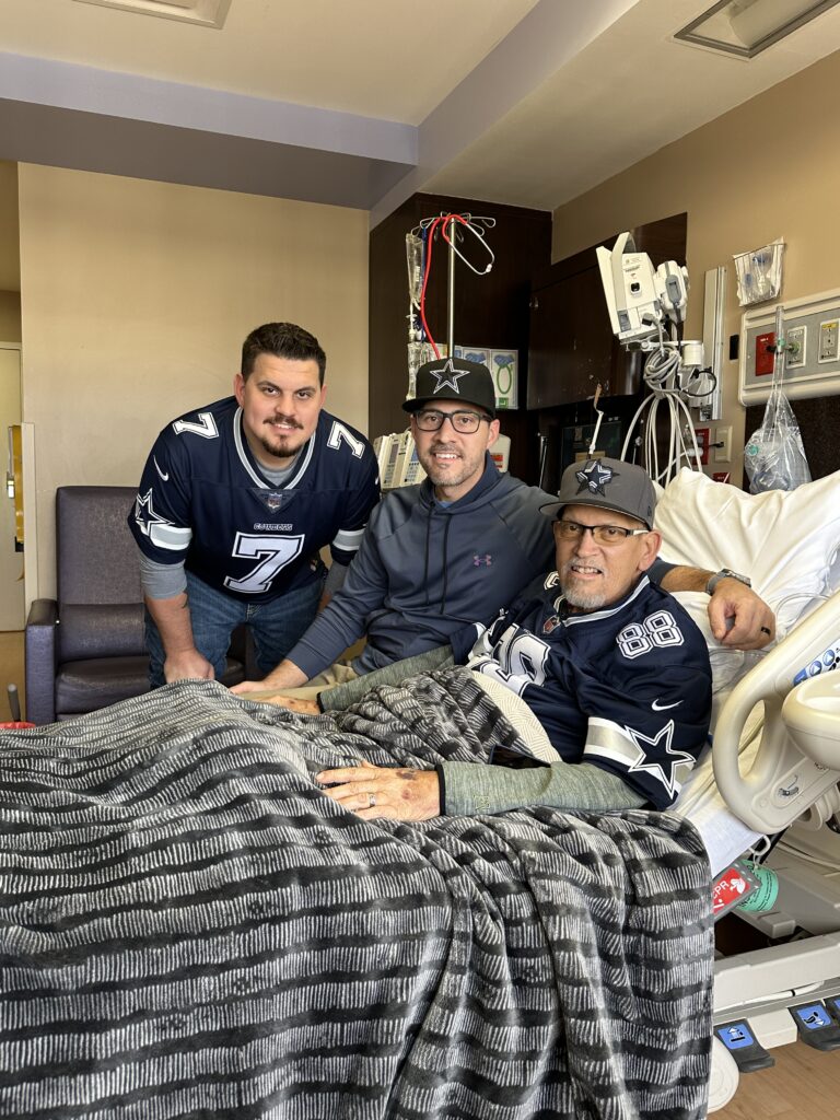 dad and 2 sons at the hospital
