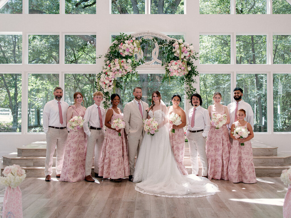 Wedding party in pastel pink floral dresses