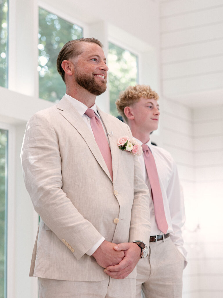Groom waiting for his bride during a French Farmhouse wedding ceremony